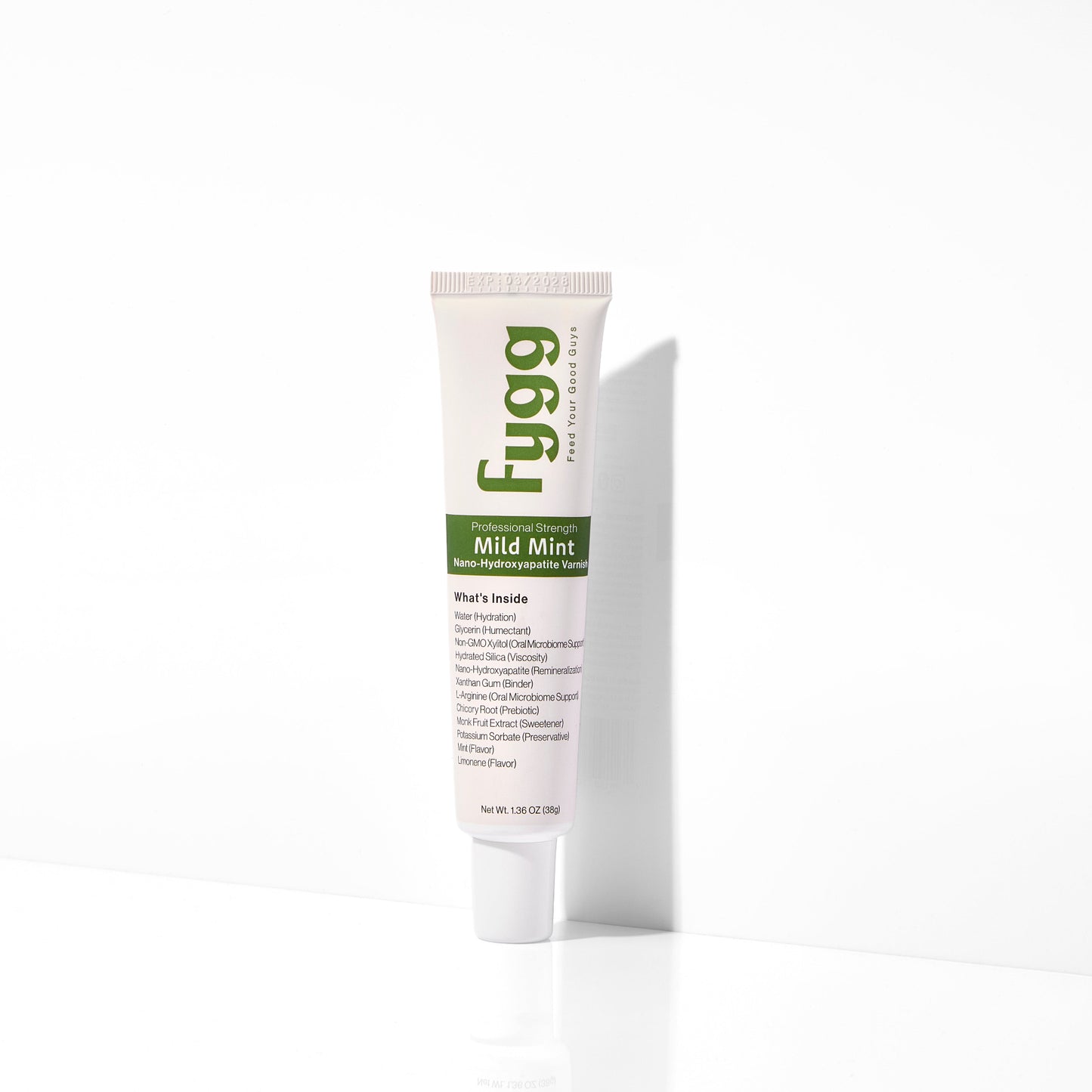 
                  
                    A single tube of Fygg Mild Mint varnish standing upright on a white surface against a white background, casting a soft shadow to the right.
                  
                